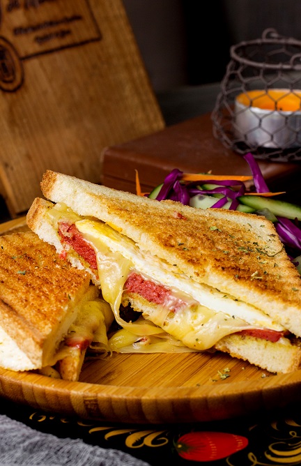 pepperoni toast with cheese served win bamboo plate